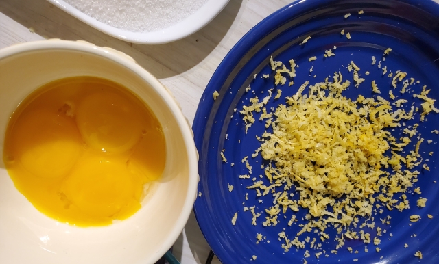 White sugar, zest and egg yolks
