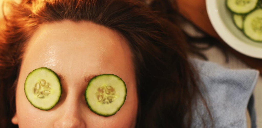 Woman with cucumbers on her eyes
